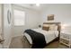 Cozy bedroom featuring carpet, an inviting bed, a window, and side tables at 1812 E Parkside E Ln, Phoenix, AZ 85024