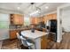 Modern kitchen with stainless steel appliances, an island with seating, and stylish finishes, ideal for culinary enthusiasts at 1812 E Parkside E Ln, Phoenix, AZ 85024