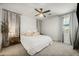 Bright and airy primary bedroom with ceiling fan, carpet, and neutral decor for a relaxing ambiance at 1812 E Parkside E Ln, Phoenix, AZ 85024