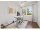 Bright and airy office space with hardwood floors, a modern desk, and views to backyard at 1812 E Parkside E Ln, Phoenix, AZ 85024