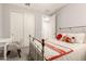 Bedroom with carpet, double door closet, desk and metal bed frame at 18368 W Long Lake Rd, Goodyear, AZ 85338