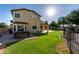 Large backyard featuring a hot tub, patio, and grassy area, ideal for relaxation and outdoor entertaining at 1918 E Megan St, Gilbert, AZ 85295
