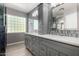 Bright bathroom with a double sink vanity, shaker cabinets, and quartz countertop at 1918 E Megan St, Gilbert, AZ 85295