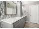 Bathroom featuring a double sink vanity, decorative backsplash, and gray shaker cabinets at 1918 E Megan St, Gilbert, AZ 85295