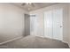 Bedroom showcasing plush carpet, closet, and doorway, ready to be personalized at 1918 E Megan St, Gilbert, AZ 85295
