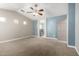 Cozy bedroom with a vaulted ceiling, ceiling fan, and ensuite bath access at 1918 E Megan St, Gilbert, AZ 85295