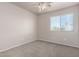 Cozy bedroom features soft carpet, neutral walls, and a bright window for natural light at 1918 E Megan St, Gilbert, AZ 85295
