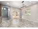 Neutral dining area with tile floors, a sliding door, and contemporary lighting fixture at 1918 E Megan St, Gilbert, AZ 85295