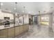 Spacious kitchen featuring granite countertops, stainless steel appliances, tile backsplash, and an open floor plan at 1918 E Megan St, Gilbert, AZ 85295