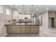 Open-concept kitchen featuring granite countertops, stainless steel appliances, tile backsplash, and modern pendant lighting at 1918 E Megan St, Gilbert, AZ 85295