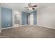 Main bedroom with ensuite bath access, neutral tones, and vaulted ceiling at 1918 E Megan St, Gilbert, AZ 85295