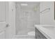 Bright bathroom featuring a glass shower, complemented by a gray vanity at 220 N 22Nd Pl # 2036, Mesa, AZ 85213