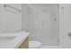 Bright bathroom features a shower with glass doors and a white herringbone tile floor at 220 N 22Nd Pl # 2036, Mesa, AZ 85213