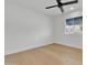 Bright bedroom with hardwood floors, white walls, and ceiling fan at 220 N 22Nd Pl # 2036, Mesa, AZ 85213