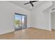 Bright bedroom with ceiling fan and sliding doors to the balcony offers a serene retreat at 220 N 22Nd Pl # 2036, Mesa, AZ 85213