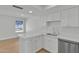 Bright kitchen with white cabinets, stainless steel appliances, and hard wood flooring at 220 N 22Nd Pl # 2036, Mesa, AZ 85213