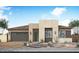 Contemporary single-story home with desert landscaping, attached garage and modern curb appeal at 2594 E Tapenade Dr, San Tan Valley, AZ 85140