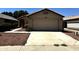 Charming single-story home with a two-car garage, desert landscaping, and a well-maintained front yard at 3027 W Zachary Dr, Phoenix, AZ 85027