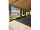 Relaxing covered back patio with views of the grassy backyard, perfect for outdoor living and entertaining at 3329 W Ross W Ave, Phoenix, AZ 85027