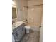 Bathroom featuring a shower-tub combo, a newer-style toilet and single sink vanity at 3329 W Ross W Ave, Phoenix, AZ 85027