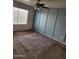 Bedroom with a unique accent wall and a fan to keep you cool in summer at 3329 W Ross W Ave, Phoenix, AZ 85027