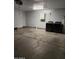 Functional garage space featuring a washer, dryer, and built-in cabinet for convenient laundry and storage at 3329 W Ross W Ave, Phoenix, AZ 85027