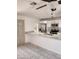 Open kitchen with stainless steel appliances, white cabinets, and breakfast bar seating at 3329 W Ross W Ave, Phoenix, AZ 85027