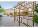 Spacious backyard with a large patio, outdoor lighting, and a charming wooden pergola at 3404 E Lavey Ln, Phoenix, AZ 85032