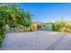 Spacious backyard featuring mature citrus trees, shed and a trellis at 3404 E Lavey Ln, Phoenix, AZ 85032