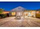 Backyard features outdoor dining and seating areas with a covered patio for entertaining at 3404 E Lavey Ln, Phoenix, AZ 85032