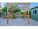 Patio in backyard with wooden trellis over paver patio at 3404 E Lavey Ln, Phoenix, AZ 85032