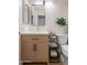 Clean bathroom with a light wood vanity and modern fixtures at 3404 E Lavey Ln, Phoenix, AZ 85032