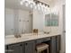 Bathroom featuring double sinks, a vanity area, and modern lighting at 3404 E Lavey Ln, Phoenix, AZ 85032