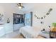 Bedroom featuring a closet with drawers and shelving near a bright window at 3404 E Lavey Ln, Phoenix, AZ 85032