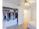 Bedroom with closet and drawers and a ceiling fan, near the door at 3404 E Lavey Ln, Phoenix, AZ 85032