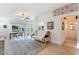 Bright and airy living room with wood floors, neutral paint, and backyard access at 3404 E Lavey Ln, Phoenix, AZ 85032