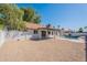 The backyard features desert landscaping, covered patio, and refreshing pool at 3608 W Fairview Ln, Chandler, AZ 85226