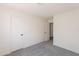 This bedroom features neutral walls, carpet flooring, and two entry ways at 3608 W Fairview Ln, Chandler, AZ 85226