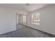Bright bedroom featuring mirrored closet doors and carpet floors at 3608 W Fairview Ln, Chandler, AZ 85226