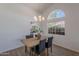 Elegant dining area with a farmhouse table, stylish chandelier, and large window at 3608 W Fairview Ln, Chandler, AZ 85226