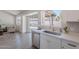 Bright, modern kitchen features stainless steel appliances, white cabinetry, and backyard views at 3608 W Fairview Ln, Chandler, AZ 85226
