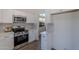 Kitchen includes stainless steel appliances, white cabinets, and quartz countertops at 3608 W Fairview Ln, Chandler, AZ 85226
