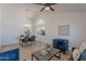 Bright living room featuring vaulted ceilings, stylish furnishings, and tile floors at 3608 W Fairview Ln, Chandler, AZ 85226