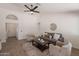 Inviting living room with high ceilings, ceiling fan and comfortable seating arrangements at 3608 W Fairview Ln, Chandler, AZ 85226