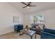 Inviting living room featuring modern furniture, neutral colors, and a ceiling fan at 3608 W Fairview Ln, Chandler, AZ 85226
