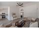 Open living area featuring a TV console and a view into the adjacent kitchen at 3608 W Fairview Ln, Chandler, AZ 85226