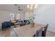 Open living area with dining table, stylish furnishings, and a ceiling fan at 3608 W Fairview Ln, Chandler, AZ 85226