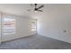 Bright bedroom featuring neutral walls, carpet floors, and large windows offering plenty of natural light at 3608 W Fairview Ln, Chandler, AZ 85226