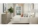Bright bedroom featuring a plant, neutral color palette and minimalist style at 36520 W Maddaloni Ave, Maricopa, AZ 85138