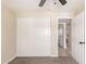 Bedroom with carpet has a closet and an open door to the bathroom at 3839 E Friess Dr, Phoenix, AZ 85032